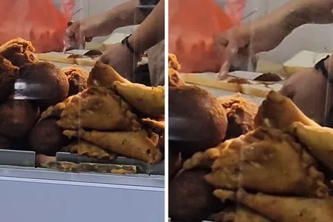 员工直接用手指沾抹疑似牛油的蘸料，涂抹在面包上。（截图自脸书Complaint Singapore）