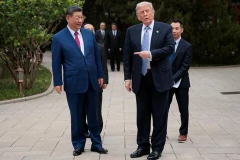 中国国家主席习近平（左）据报拟率领庞大中国企业代表团访美。图为美国总统特朗普（右）今年5月访华时，在习近平陪同下到访中南海。（路透社档案照）