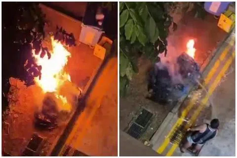 回收箱被火舌包围，不断冒出阵阵浓烟，火势相当猛烈，男居民加布里埃尔（Gabriel）挺身而出救火。（取自Stomp）