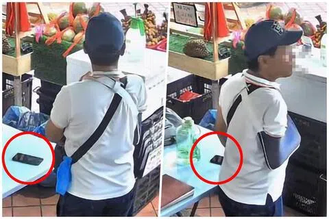 涉事男子走到摊位的桌子旁，目光紧锁桌上的两部手机，并在原地徘徊约10多秒。男子过后调整站姿，疑似试图用身体遮挡手部动作，但仍被摄像头拍到他拿起其中一部手机放进口袋。（截图自Instagram）