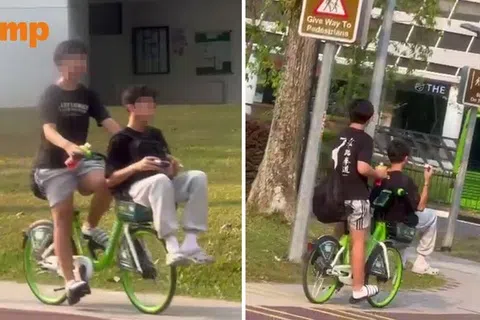一名青少年在义顺骑着共享脚踏车时，前方车篮竟坐着另一名青少年。（Stomp提供）