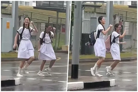 两名女学生雨中过马路时，悠然起舞的一段视频近日在网上爆红。（TikTok视频截图）