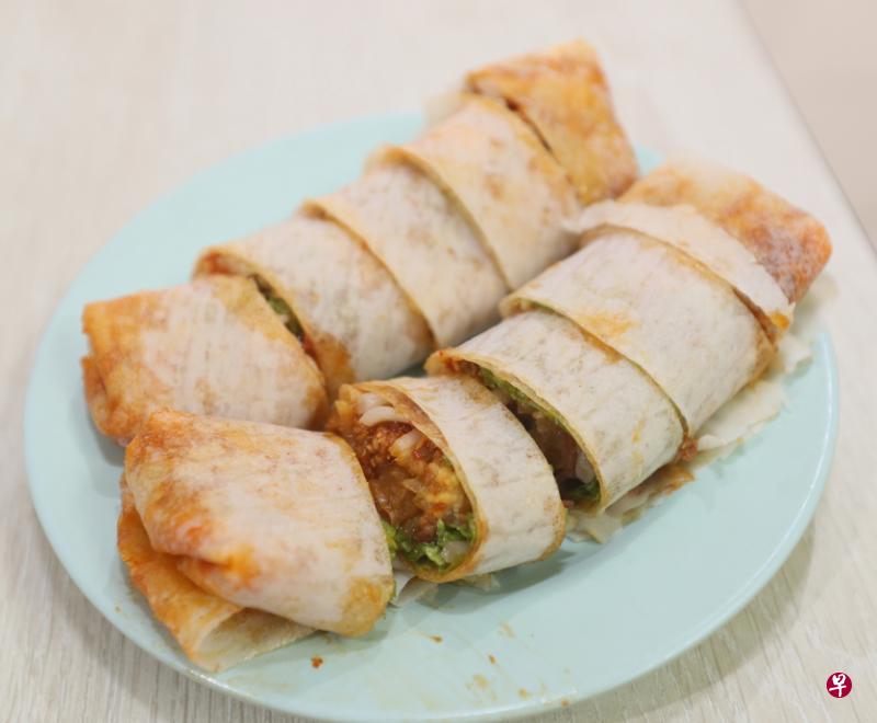 卷卷薄饼吃出记忆幸福的好滋味。（档案照）
