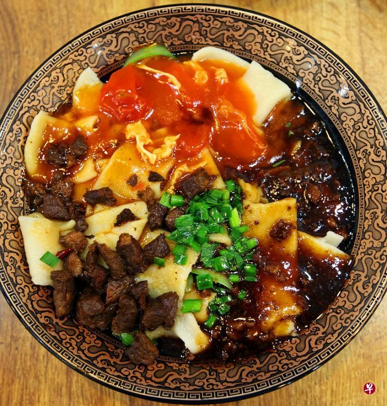 西安人喜食面食，图为西安著名美食biang biang（发二声）面。