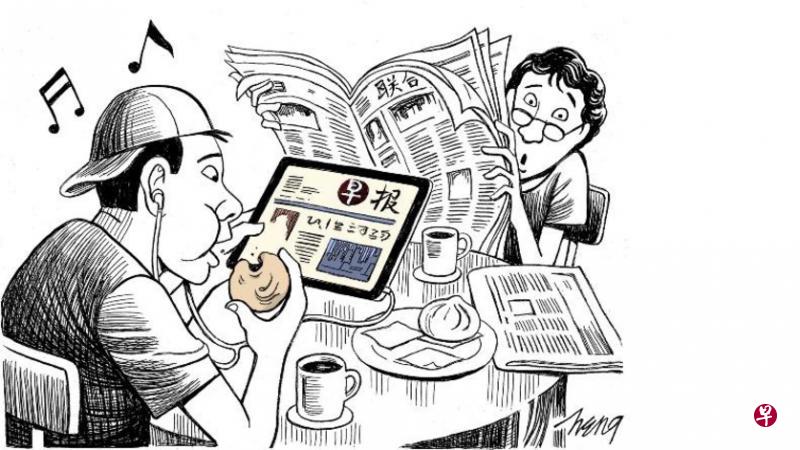用iPad看报纸，既能一手看（可随意放大字体的）报纸，也能一手吃包子，李显龙总理以用iPad看报纸为例，说明学习现代科技的好处。（王锦松）
