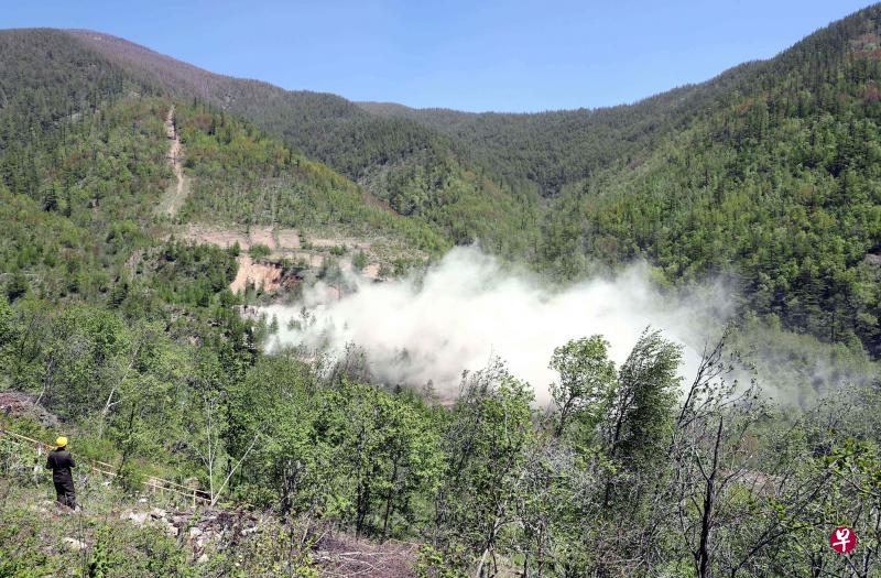 朝鲜5月24日炸毁丰溪里核试验场的多条坑道，正式废弃这个主要的核试场地，在特金会前释出善意。（法新社）