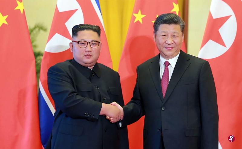 6月19日，金正恩与习近平在北京会晤。（法新社）