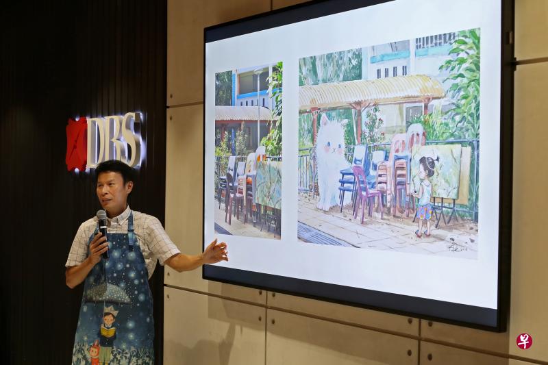 阿果穿上朋友为他定制的插画家围裙，与早报读者和粉丝分享他的创意点滴。