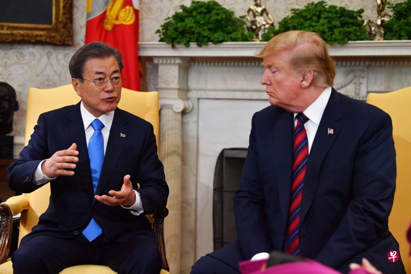 美国总统特朗普11日在白宫会见到访的韩国总统文在寅。（法新社）