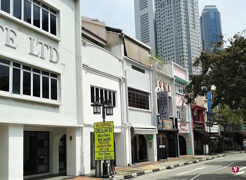 沙球劳路一间店屋外墙还保留着“正记布庄”的名字。
