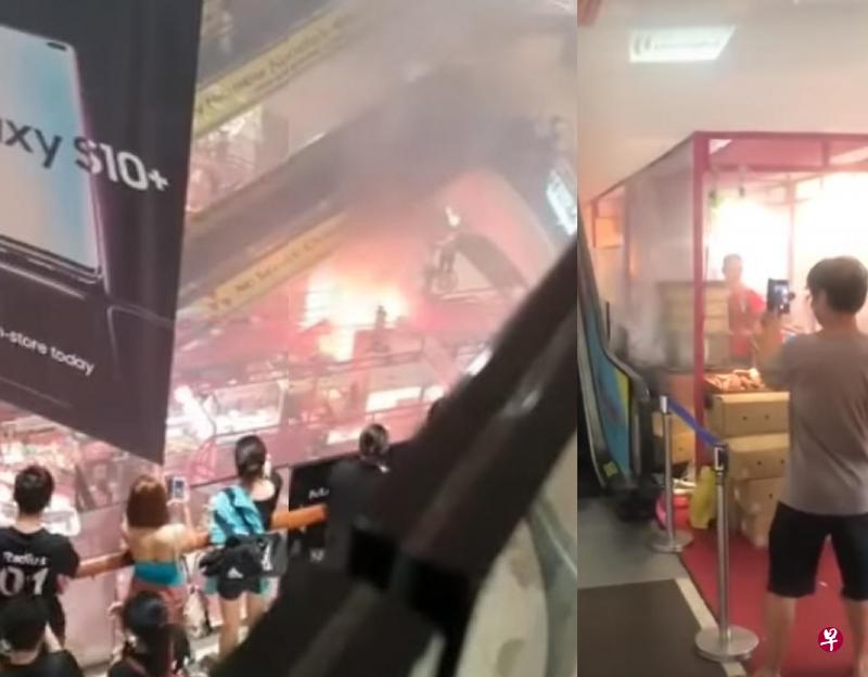淡滨尼广场日本美食展的其中一个摊位突然失火，不少公众丝毫没有离开的打算，反倒是掏出手机猛拍。（互联网）