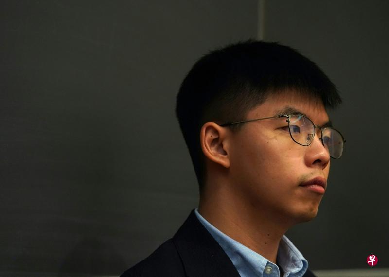 香港众志秘书长黄之锋呼吁美国总统特朗普将“人权条款”纳入与中国大陆的贸易协议中。（法新社）