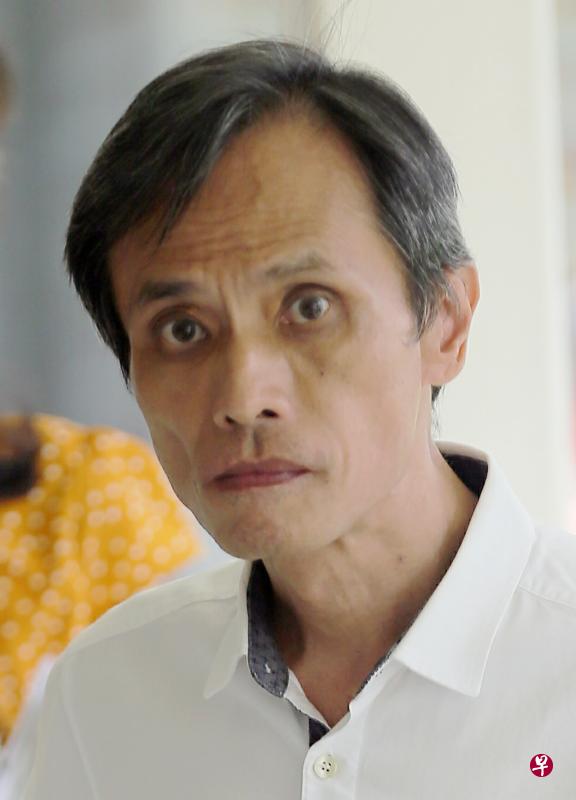 被告周德强是一名企业发展总监。（海峡时报）