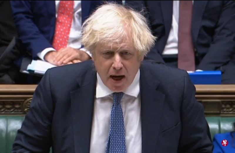 英国首相约翰逊说，英国将“外交抵制”明年2月在北京举行的冬季奥会。（法新社） 