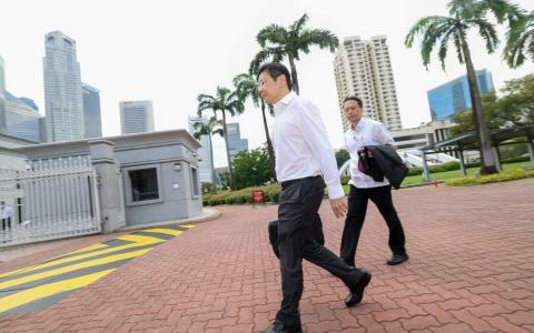 2024年2月16日财政预算案演讲日，副总理兼财政部长黄循财走向国会大厦。（蔡家增摄）