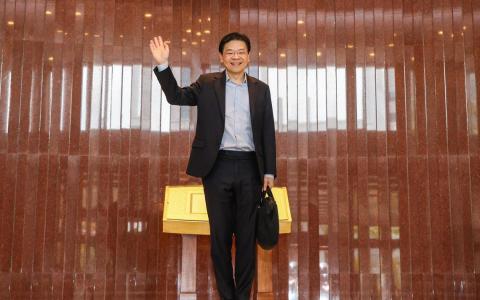 2月18日，新加坡总理兼财政部长黄循财抵达国会发表2025年财政预算案。 （白艳琳摄）