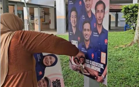 代表红点同心党竞逐裕廊东—武吉巴督集选区的参选人莉雅娜，5月9日在脸书贴出自己在选区移除多个违规海报的视频。（取自莉雅娜脸书）