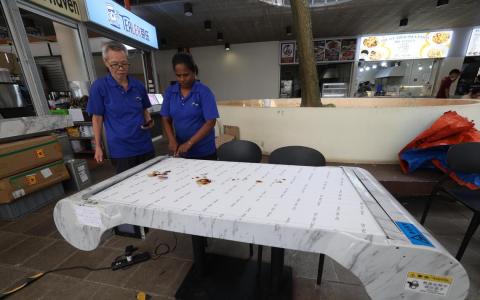 南大食阁自动清洗桌启用半年 食客反应不一